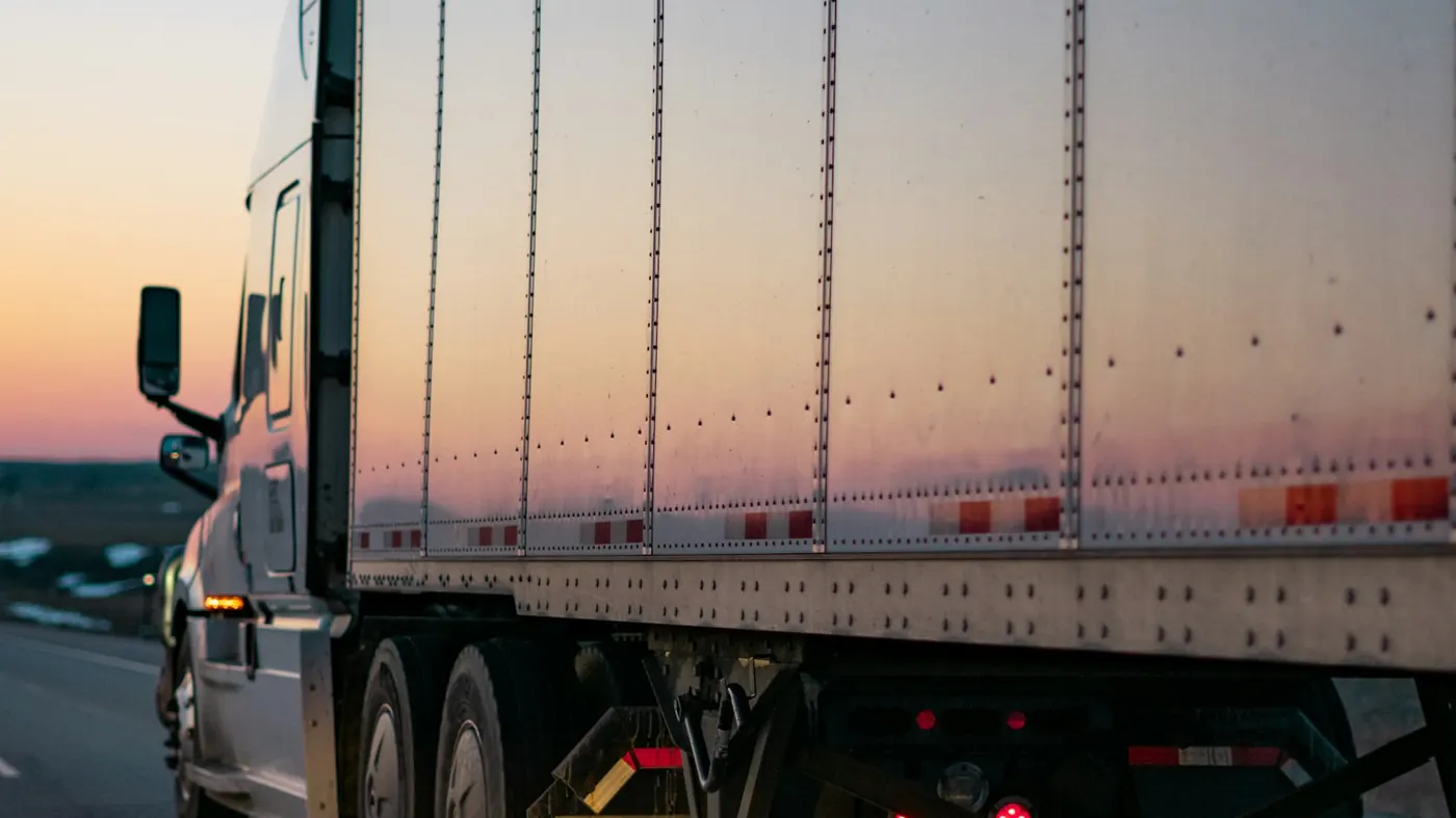 Semi trailer on the highway at dusk